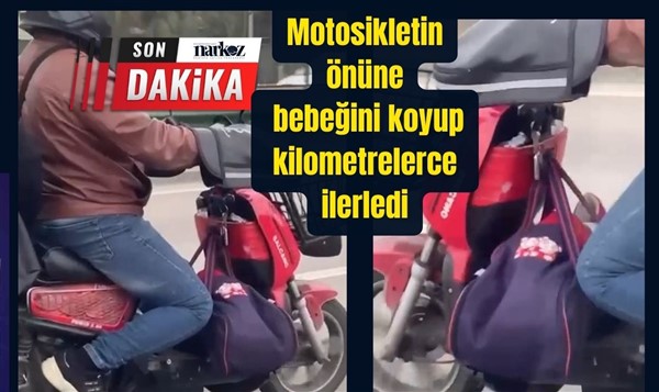 Motosikletin önüne bebeğini koyup kilometrelerce ilerledi